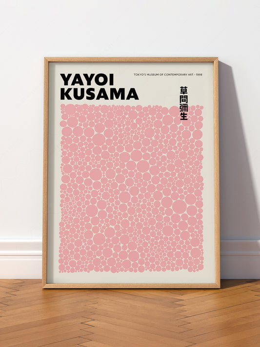 Yayoi Kusama Pink Dots wall art print displayed in a bright modern living room