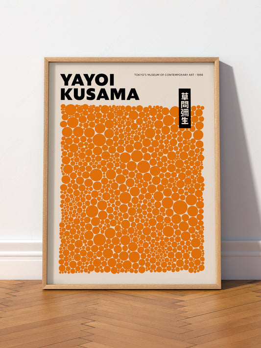 Yayoi Kusama Orange Dots Exhibition wall art print displayed in a bright modern living room