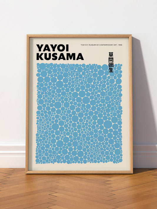Yayoi Kusama Blue Dots Exhibition wall art print displayed in a bright modern living room
