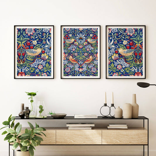 William Morris Strawberry Thief set of three art prints featuring birds and floral patterns on deep blue background.