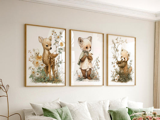 Woodland nursery wall art set featuring baby deer, fox cub, and red panda storybook prints with wildflowers.