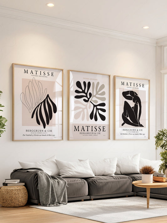 Henri Matisse gallery wall set of three art prints featuring papiers découpés cut-outs in black and beige tones.