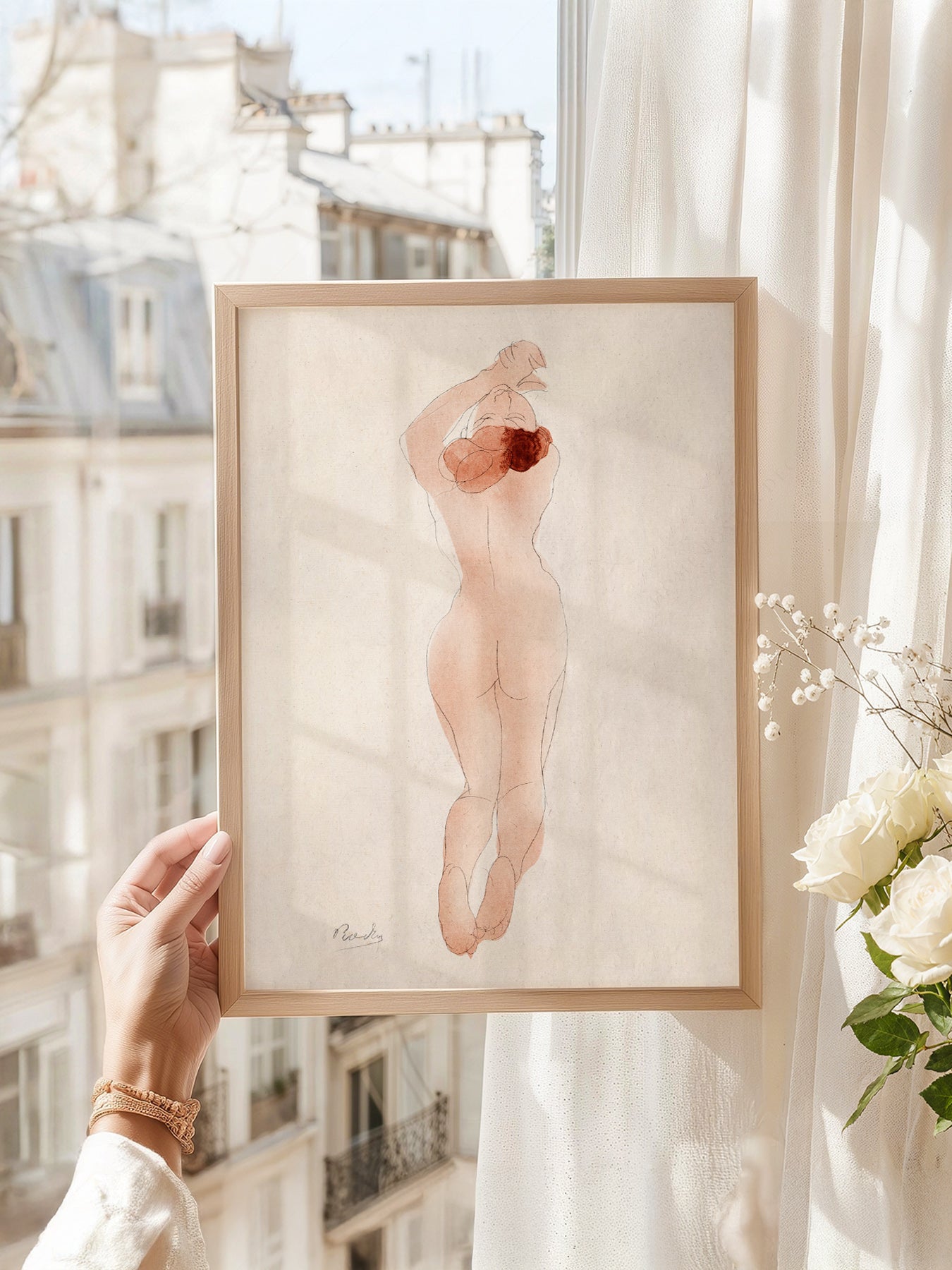 Auguste Rodin art print as wall decor in a minimalist home office