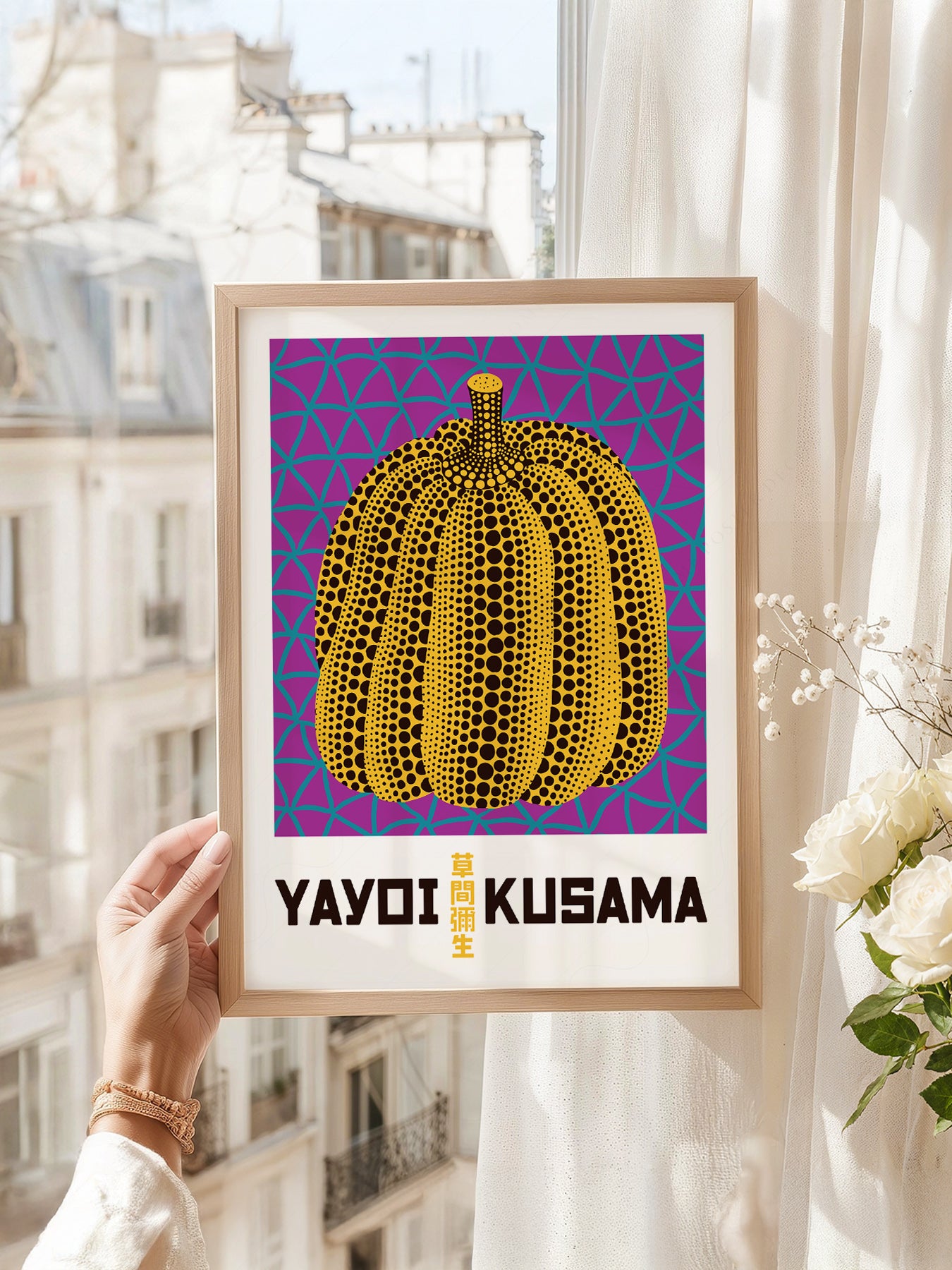 Yayoi Kusama art print as wall decor in a minimalist home office