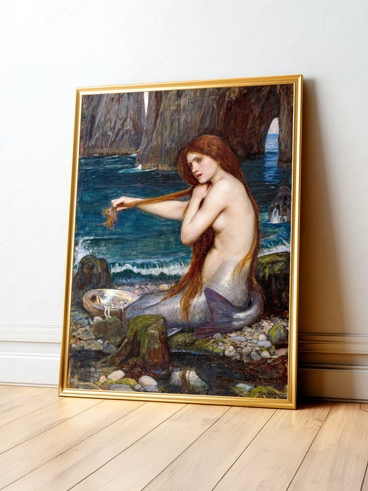 John William Waterhouse A Mermaid art print depicting a red-haired mermaid combing her hair on coastal rocks.