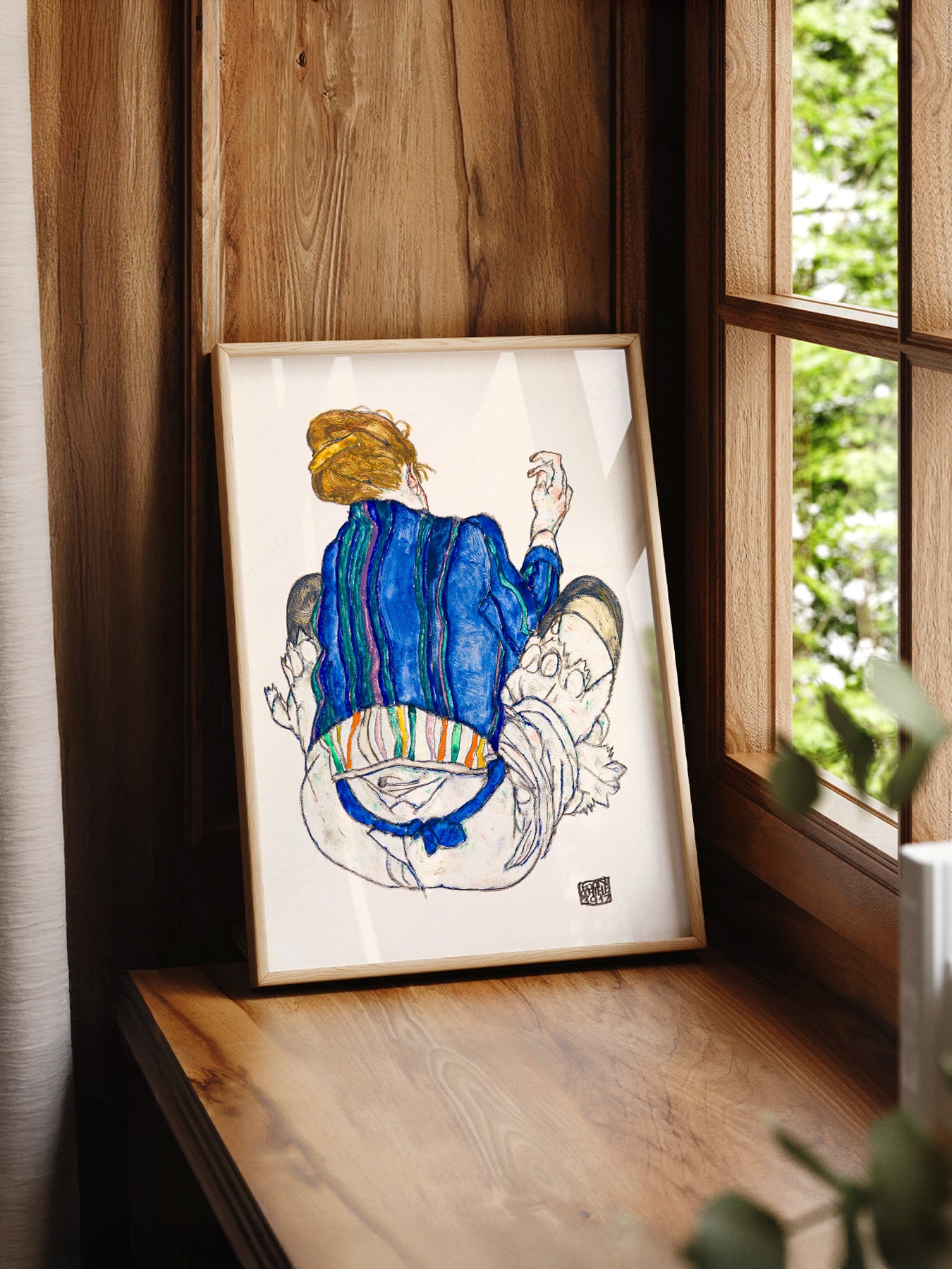 Egon Schiele Seated Woman Back View 1917 print styled in a mid-century modern dining room