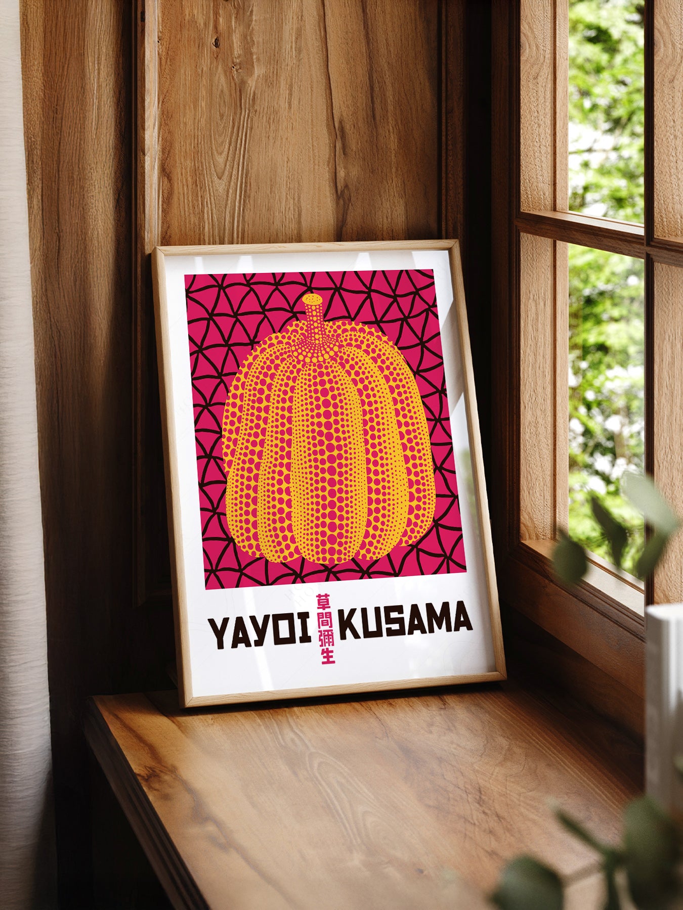 Yayoi Kusama Pumpkin print styled in a mid-century modern dining room