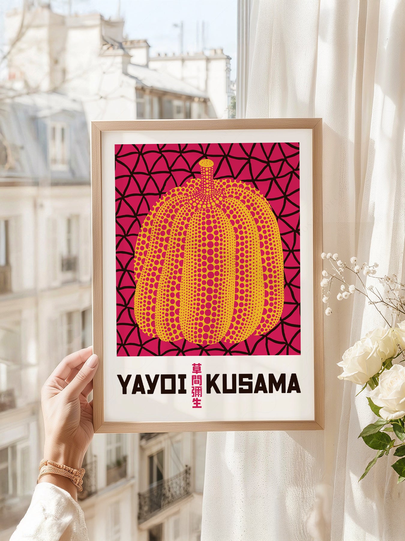 Yayoi Kusama art print as wall decor in a minimalist home office