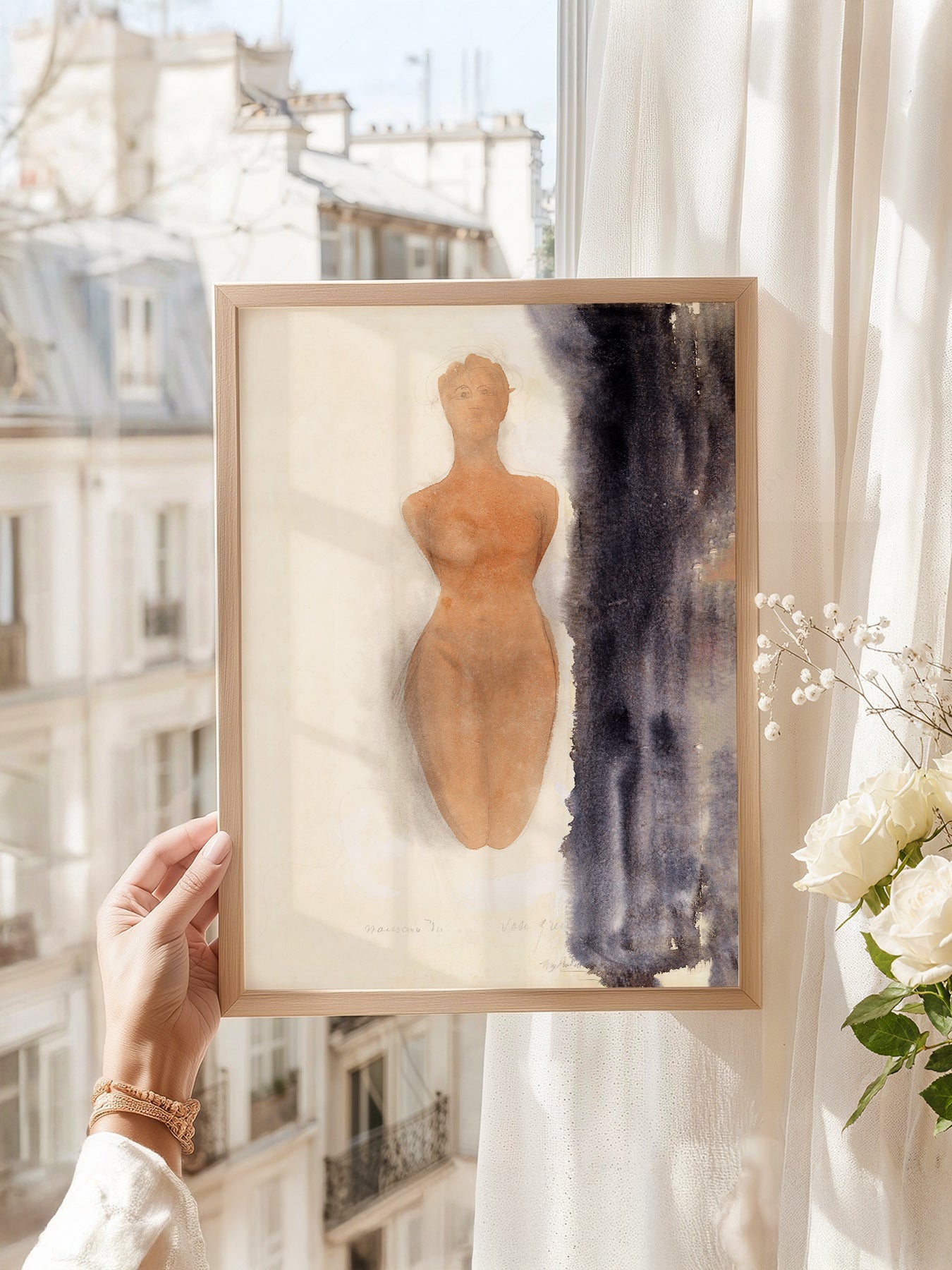 Auguste Rodin art print as wall decor in a minimalist home office