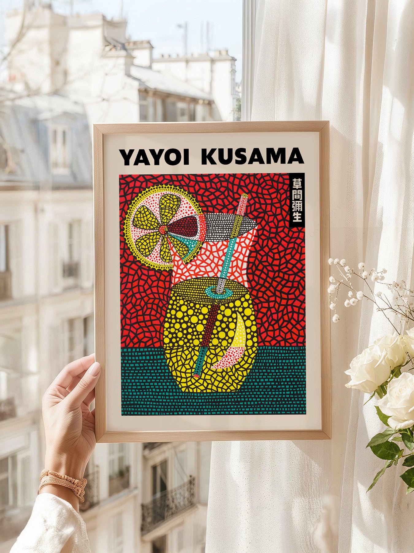 Yayoi Kusama art print as wall decor in a minimalist home office