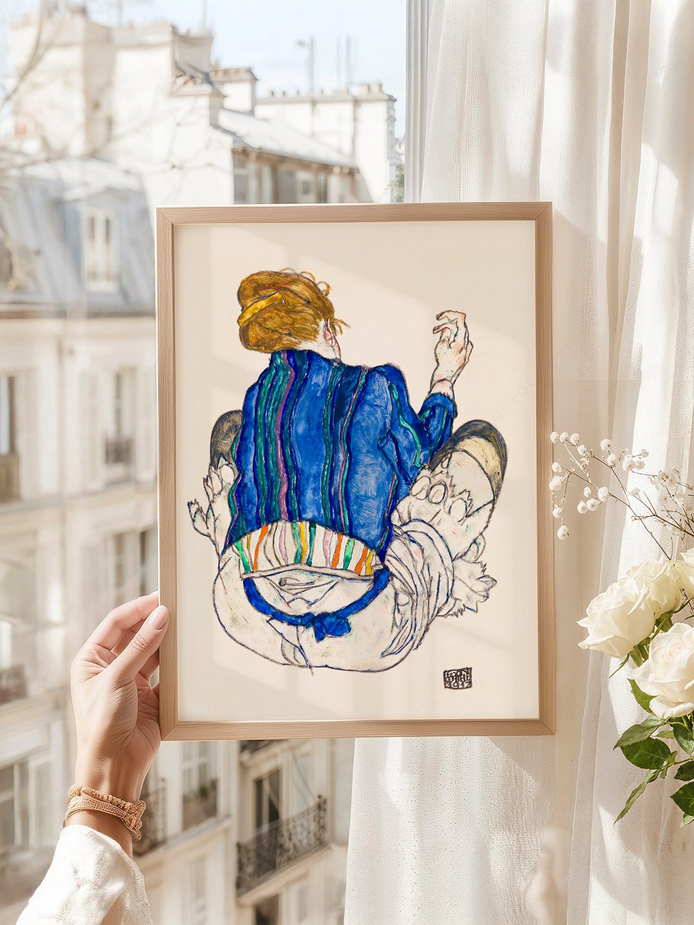 Egon Schiele art print as wall decor in a minimalist home office
