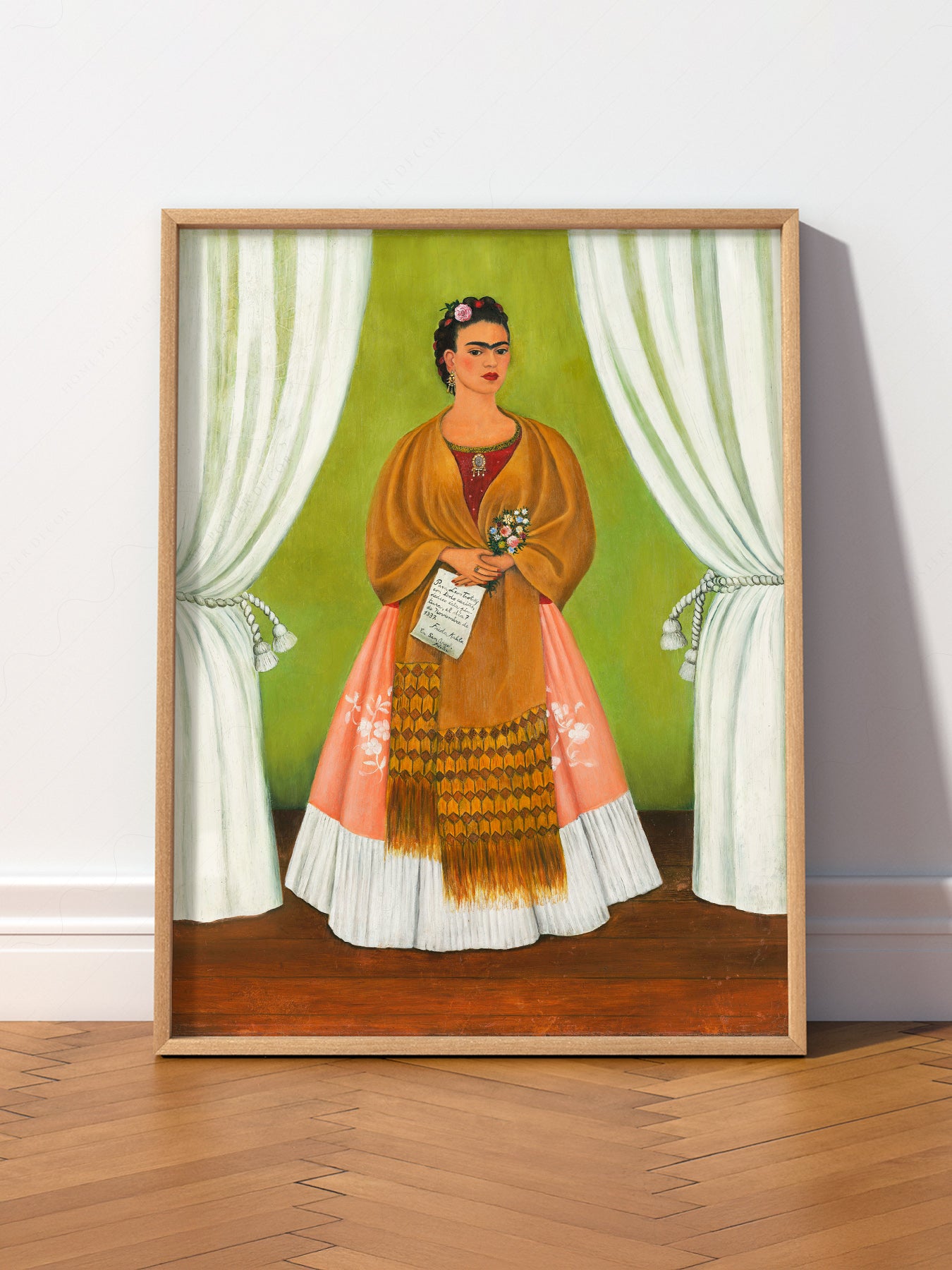 Frida Kahlo self-portrait art print featuring the artist in traditional Tehuana dress with green backdrop wall art.
