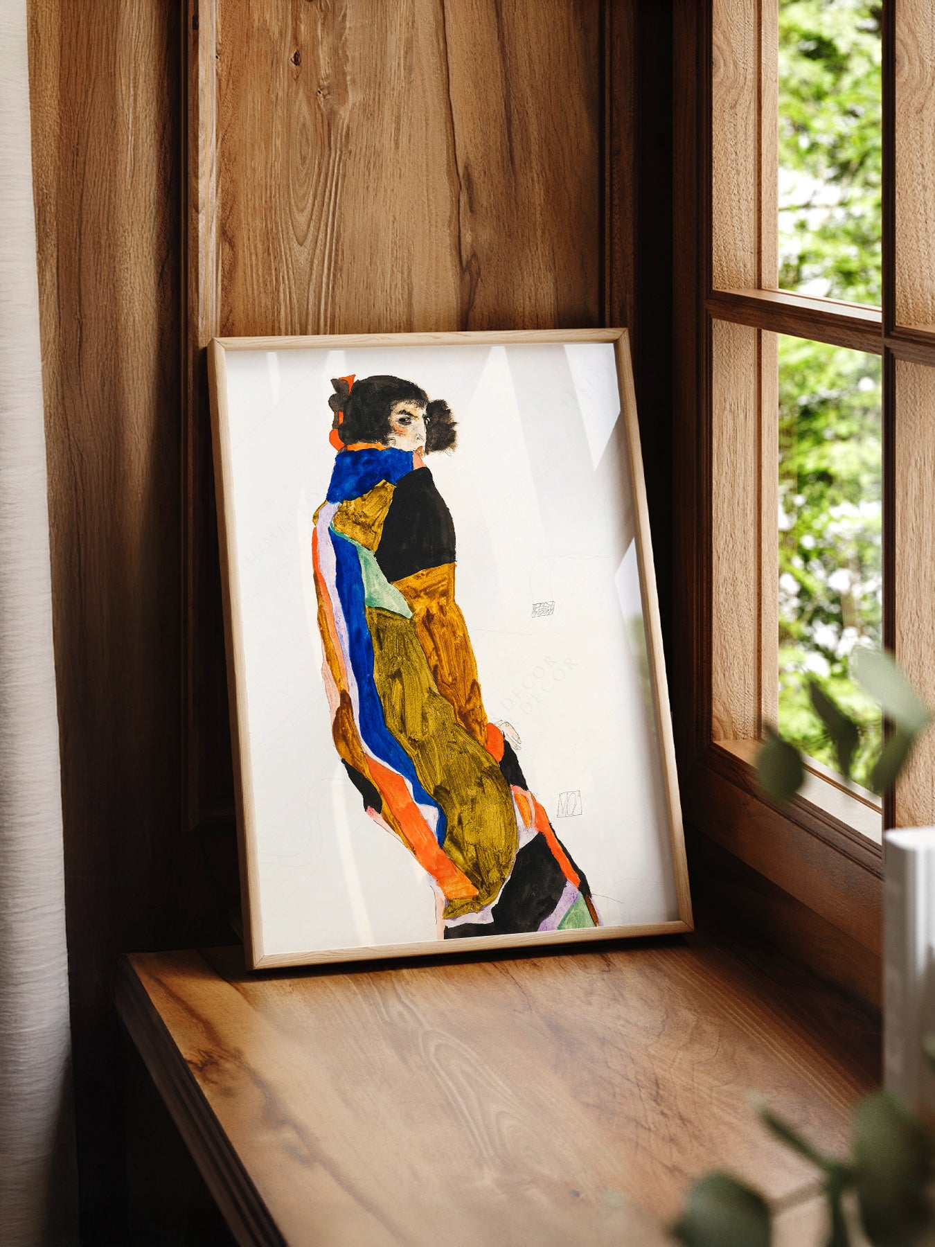 Egon Schiele Moa print styled in a mid-century modern dining room