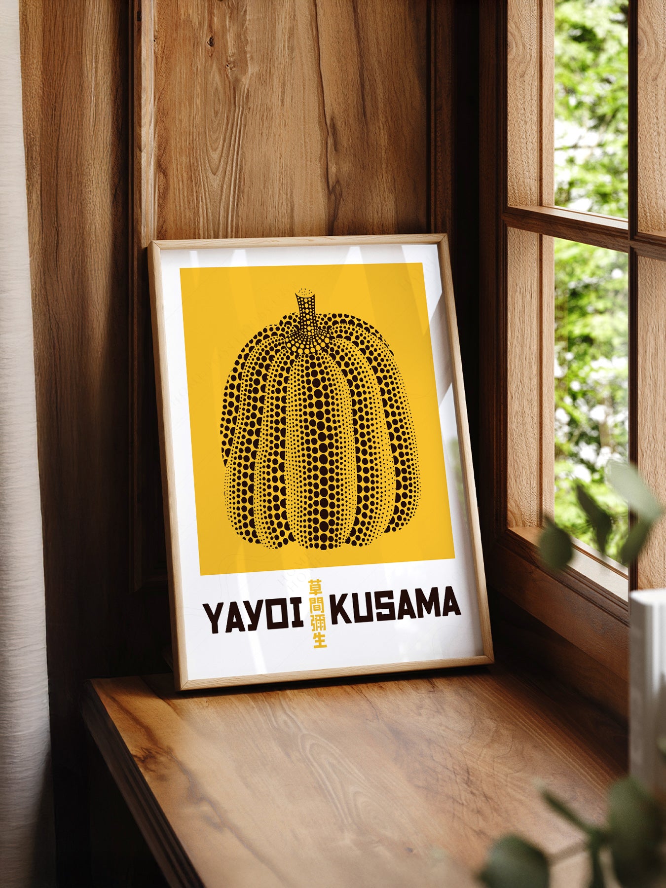 Yayoi Kusama Yellow Pumpkin print styled in a mid-century modern dining room