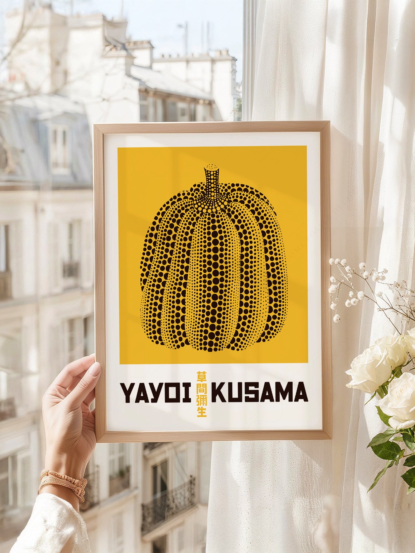 Yayoi Kusama art print as wall decor in a minimalist home office