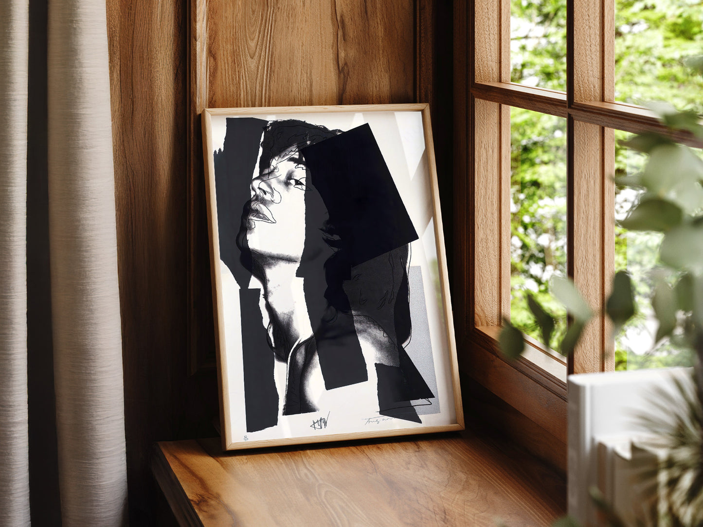 Andy Warhol art print as wall decor in a minimalist home office