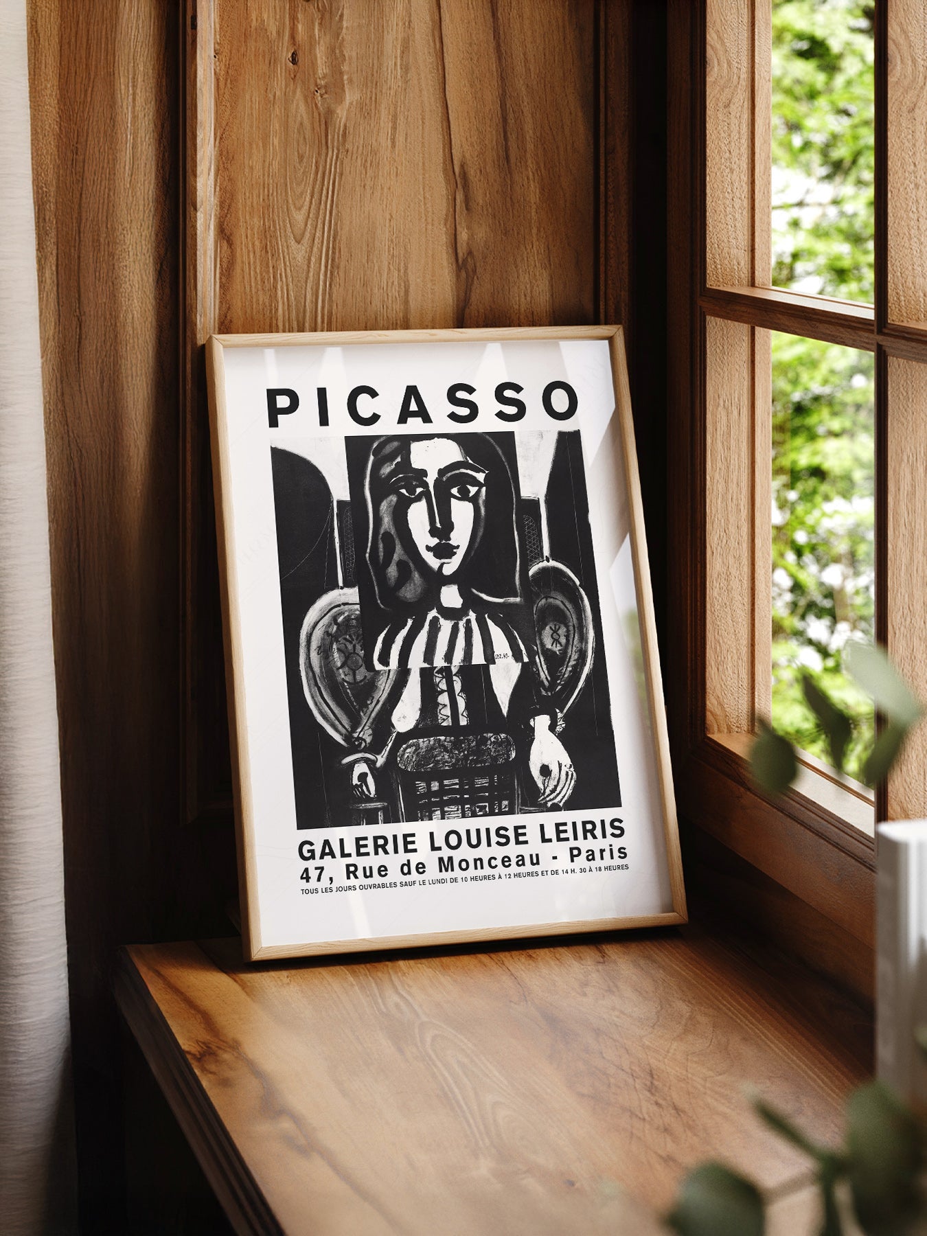 Pablo Picasso Galerie Louise Leiris print styled in a mid-century modern dining room