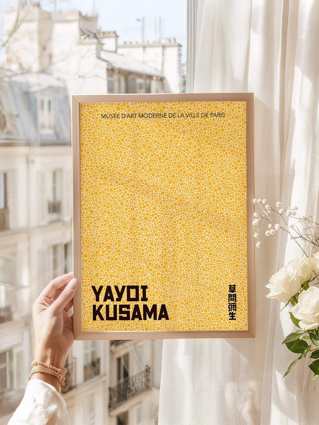 Yayoi Kusama art print as wall decor in a minimalist home office