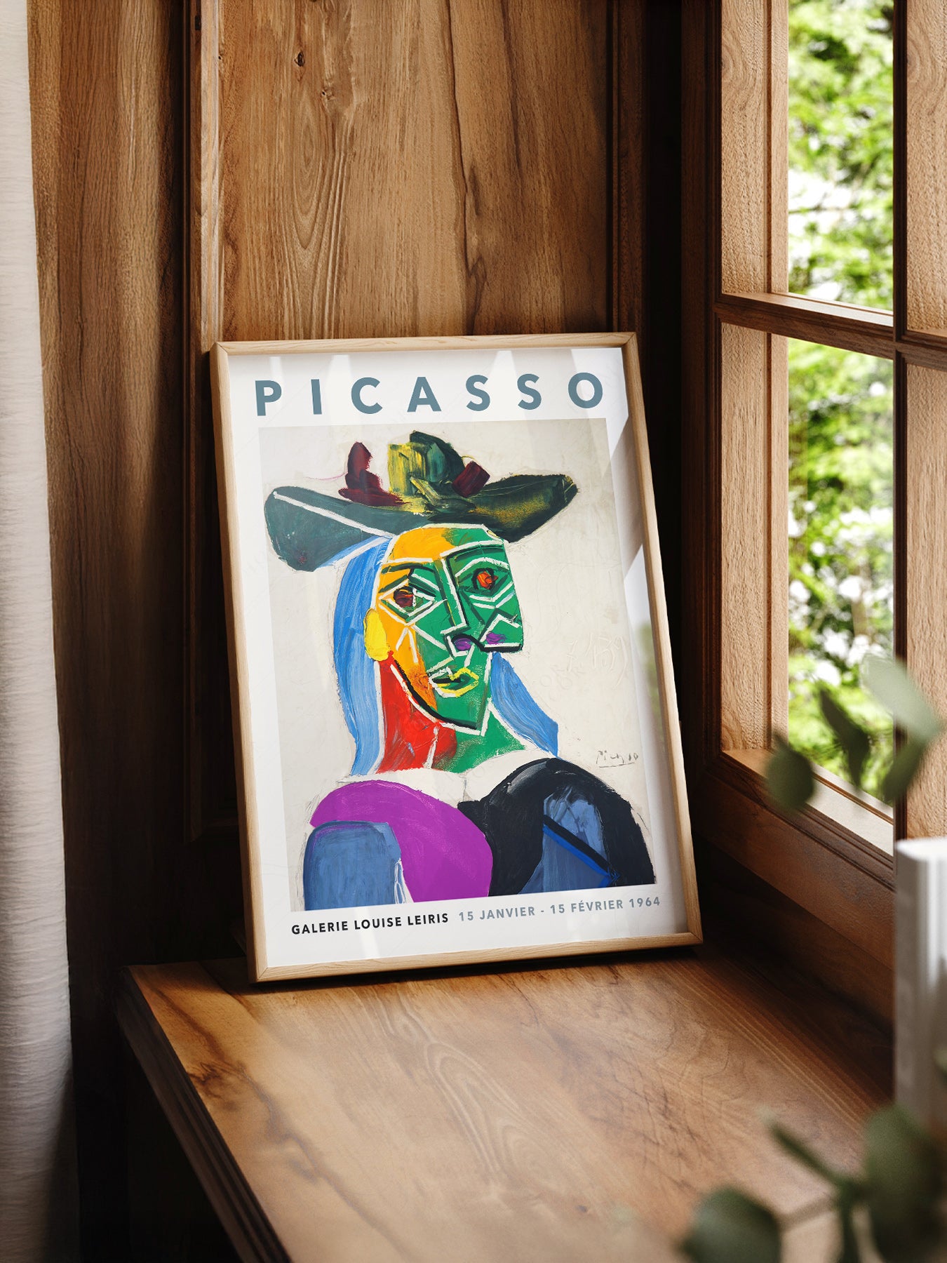 Pablo Picasso Portrait of Dora Maar print styled in a mid-century modern dining room