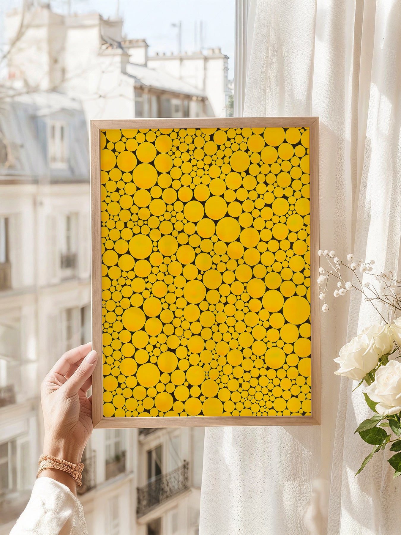 Yayoi Kusama art print as wall decor in a minimalist home office
