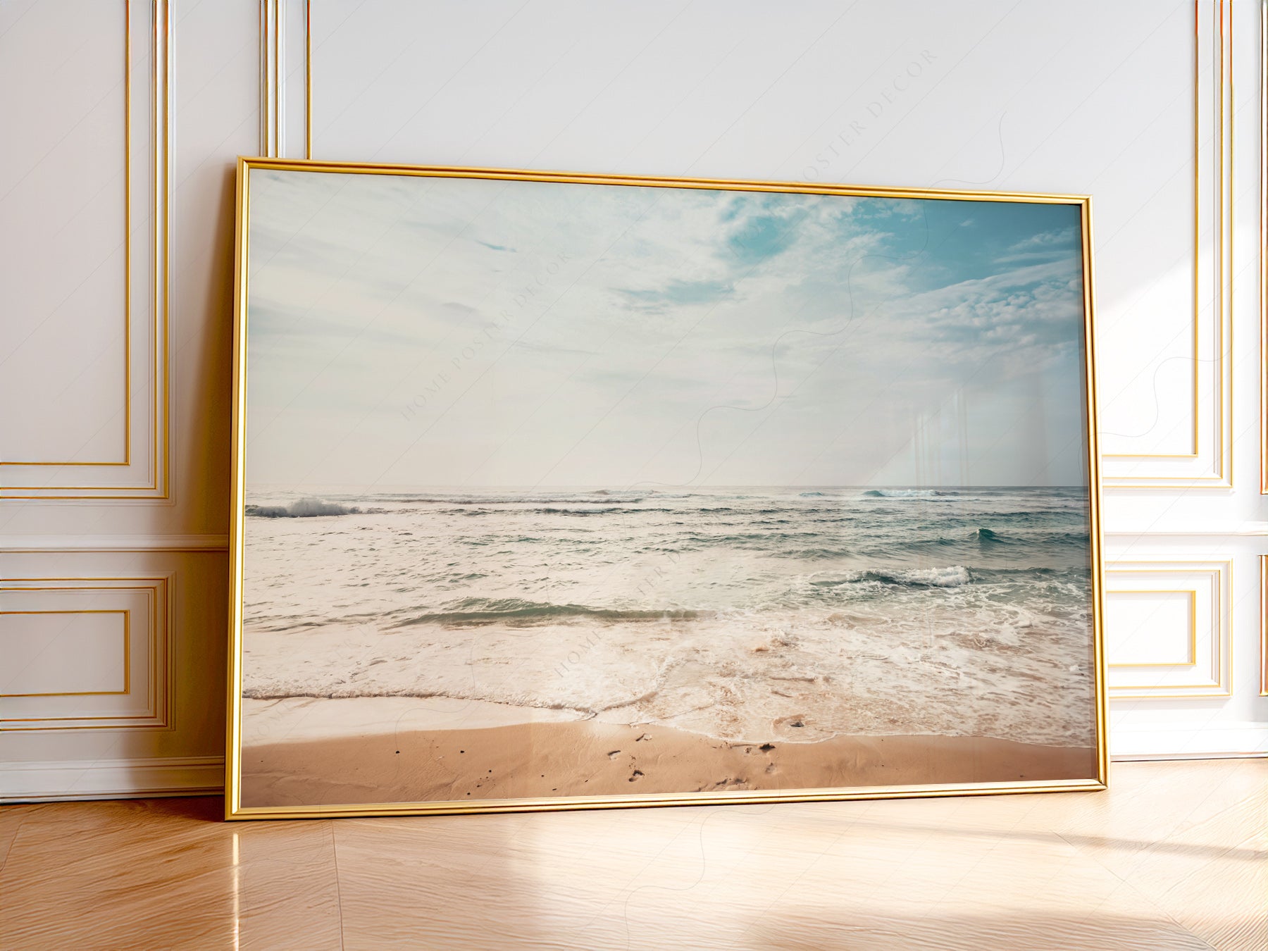 Coastal beach photography wall art print featuring gentle ocean waves rolling onto sandy shore under soft cloudy sky.