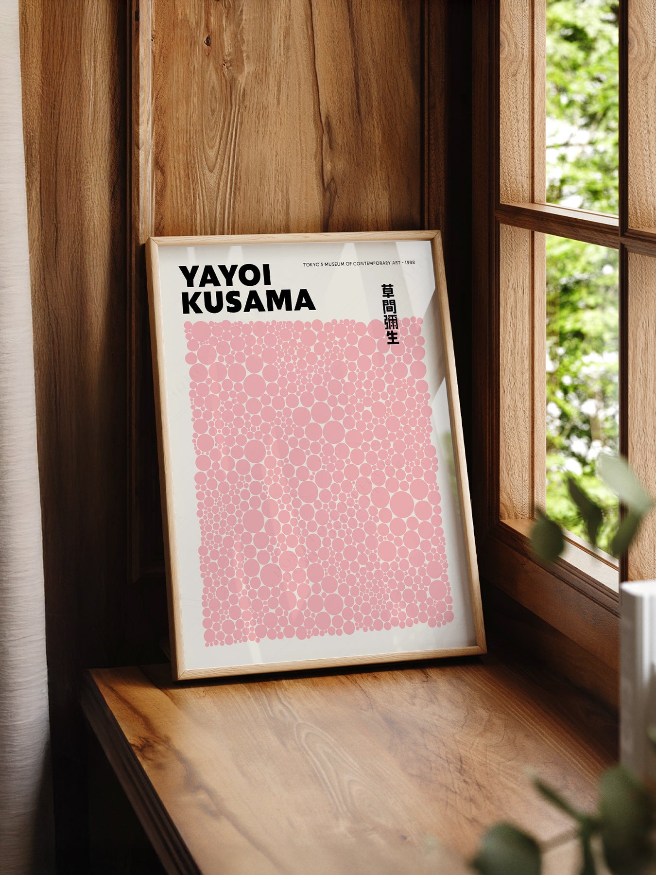 Yayoi Kusama Pink Dots print styled in a mid-century modern dining room