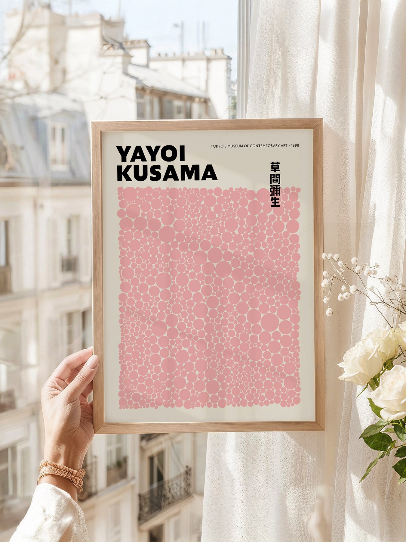 Yayoi Kusama art print as wall decor in a minimalist home office