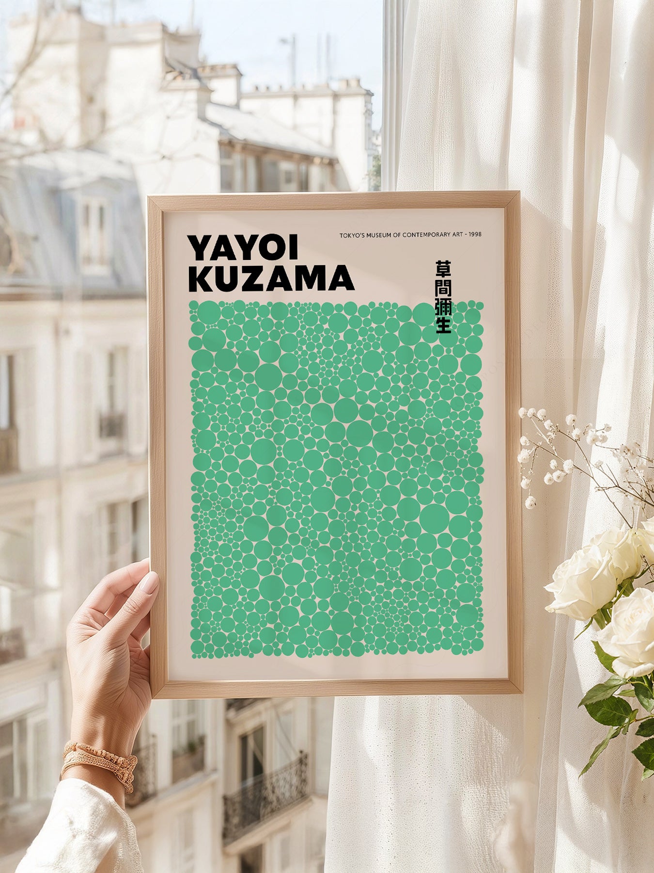 Yayoi Kusama art print as wall decor in a minimalist home office