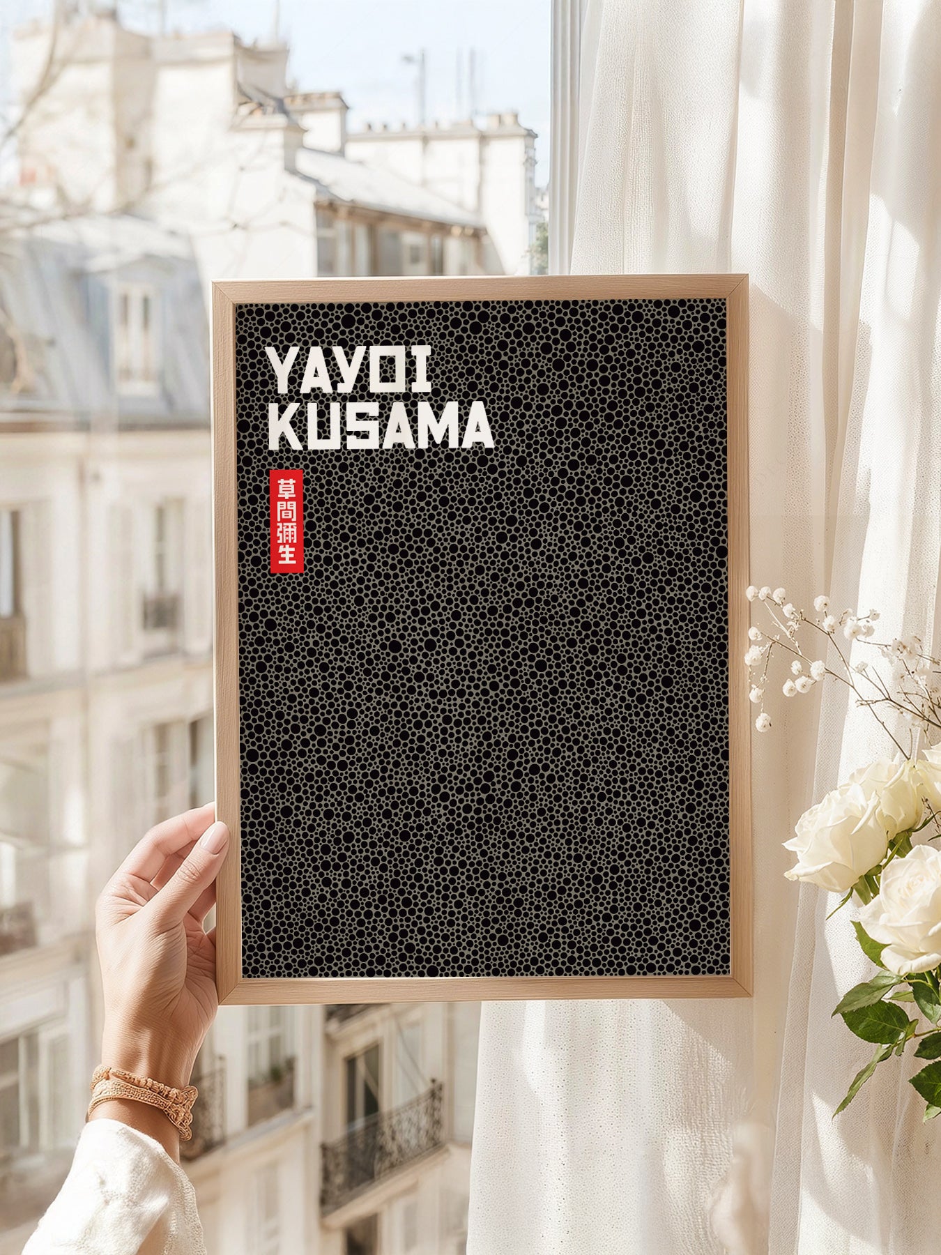Yayoi Kusama art print as wall decor in a minimalist home office