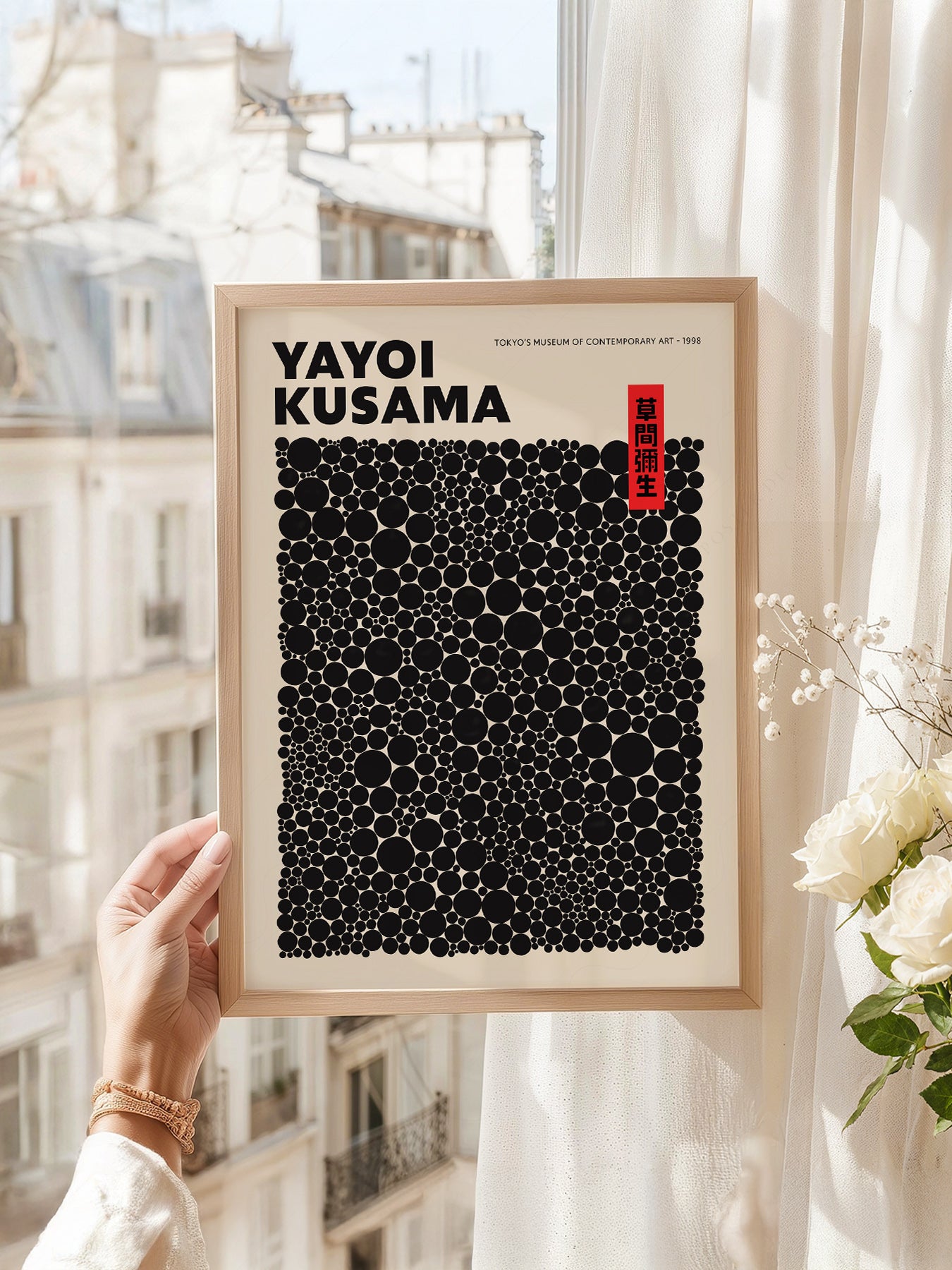Yayoi Kusama art print as wall decor in a minimalist home office