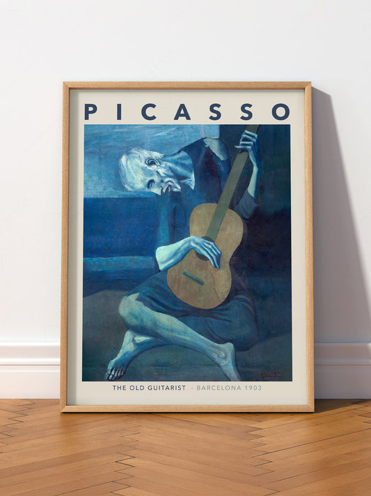 Pablo Picasso The Old Guitarist wall art print displayed in a bright modern living room