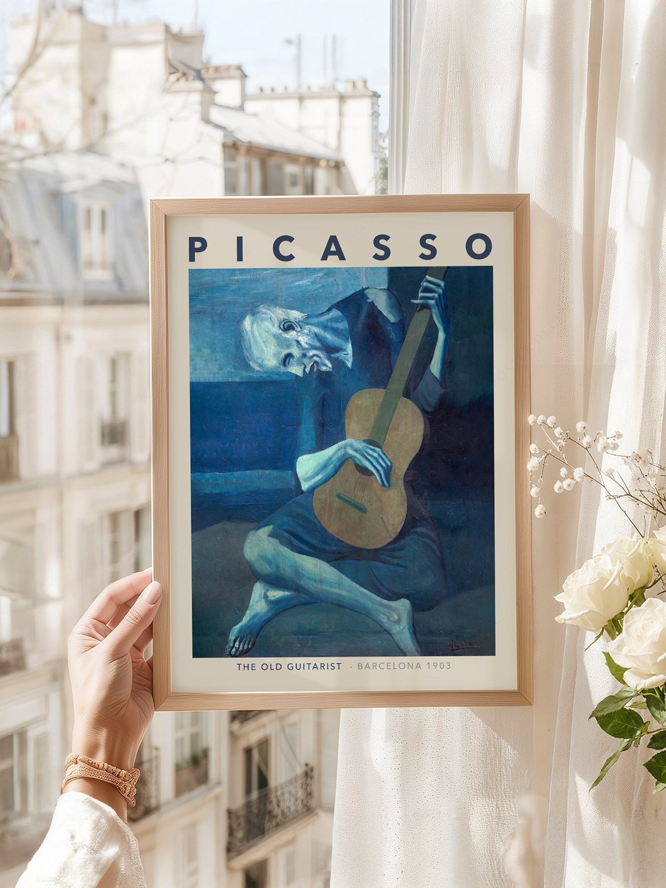 Pablo Picasso art print as wall decor in a minimalist home office