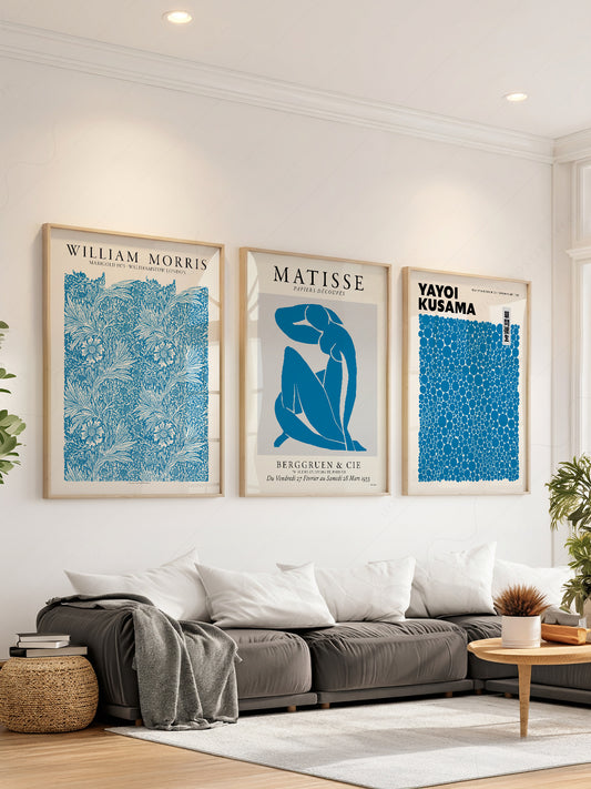 Blue gallery wall art set featuring William Morris, Matisse, and Yayoi Kusama exhibition posters in a modern living room.