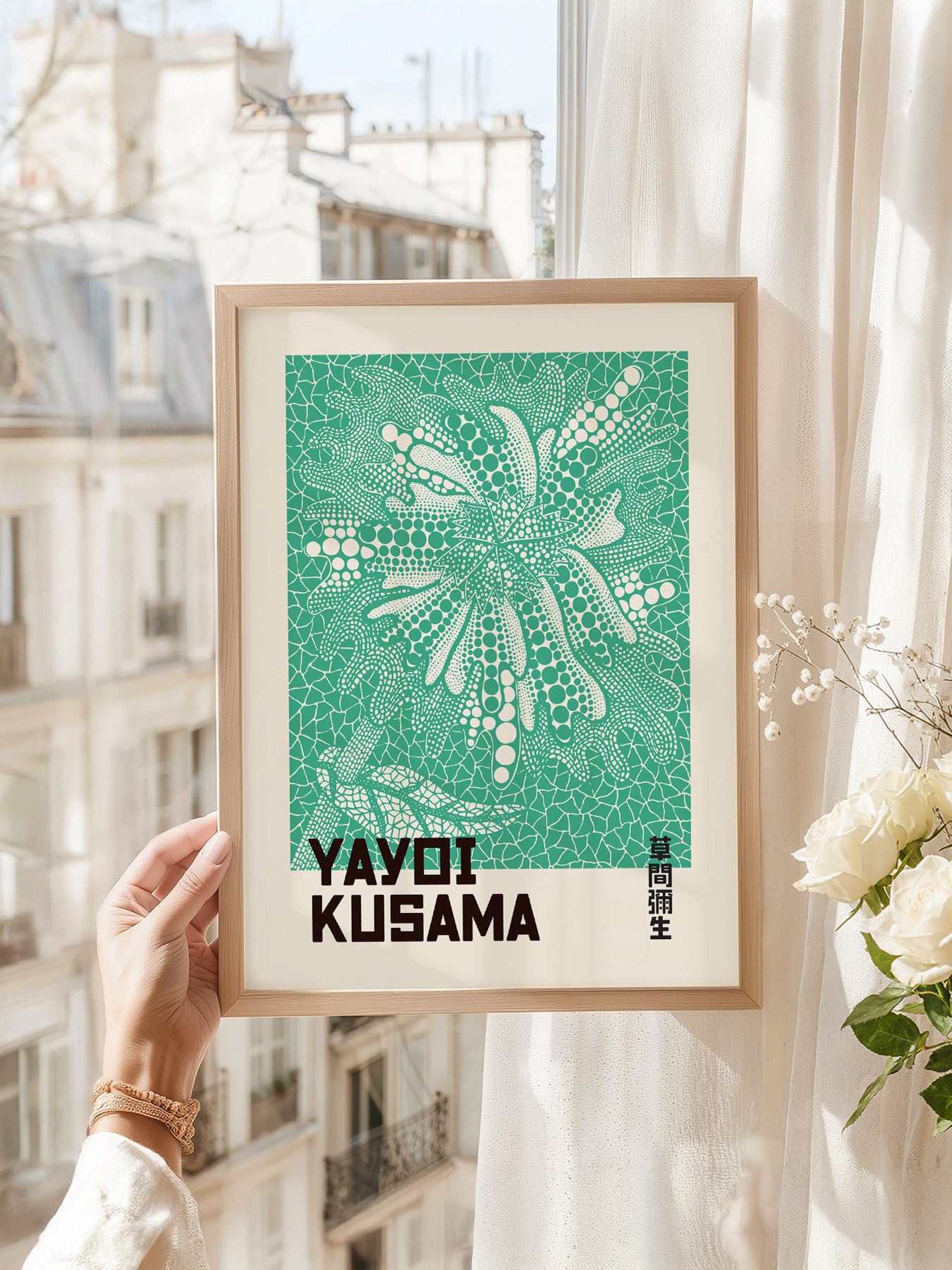 Yayoi Kusama art print as wall decor in a minimalist home office