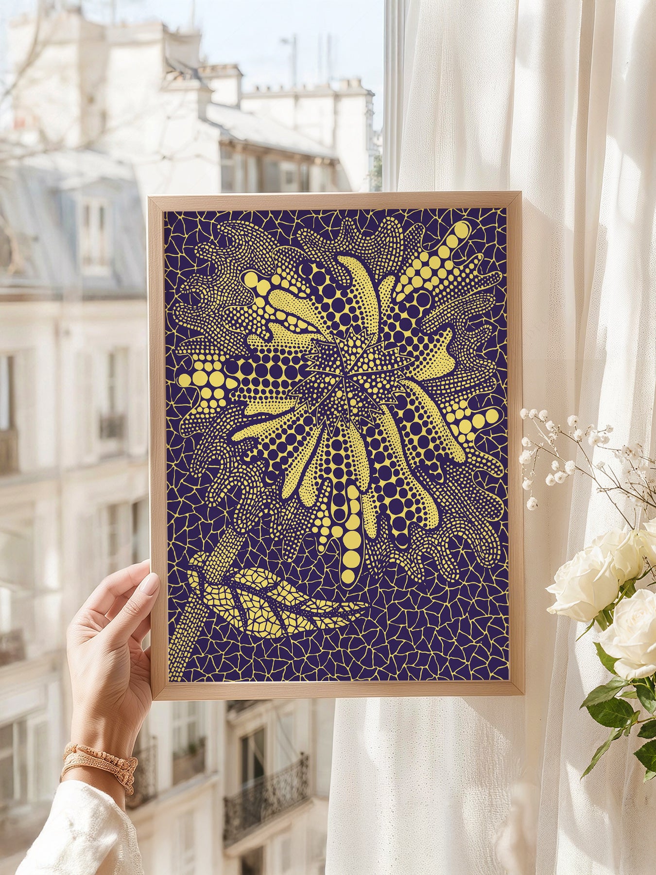 Yayoi Kusama art print as wall decor in a minimalist home office