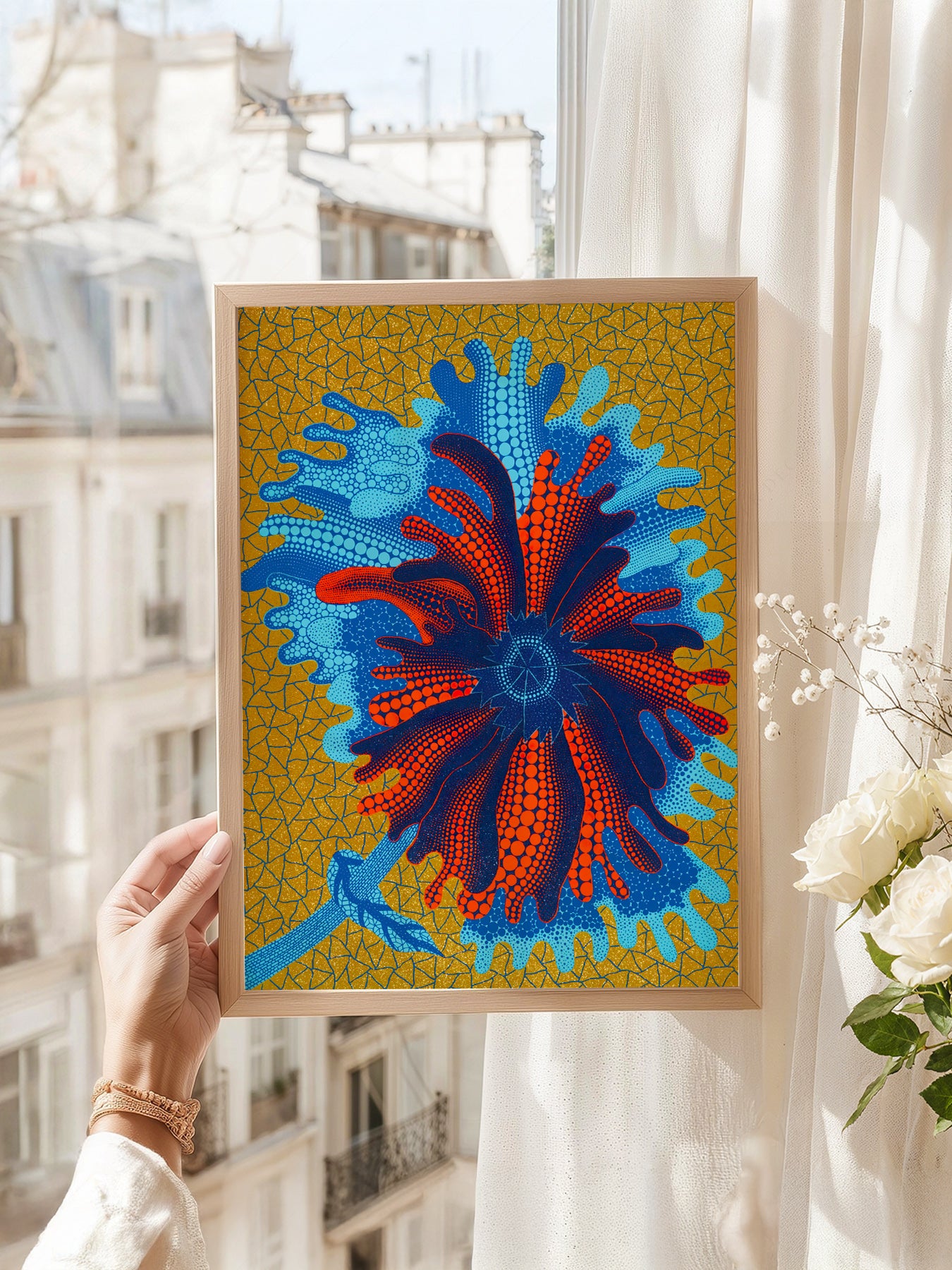 Yayoi Kusama art print as wall decor in a minimalist home office