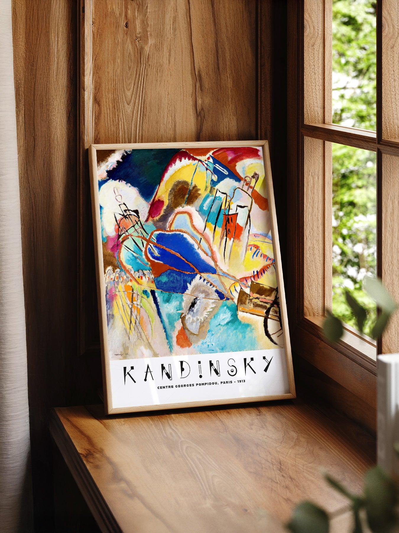 Wassily Kandinsky Improvisation 1913 print styled in a mid-century modern dining room