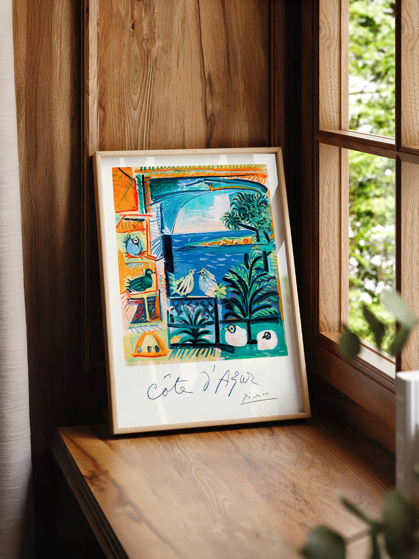 Pablo Picasso Côte d'Azur print styled in a mid-century modern dining room