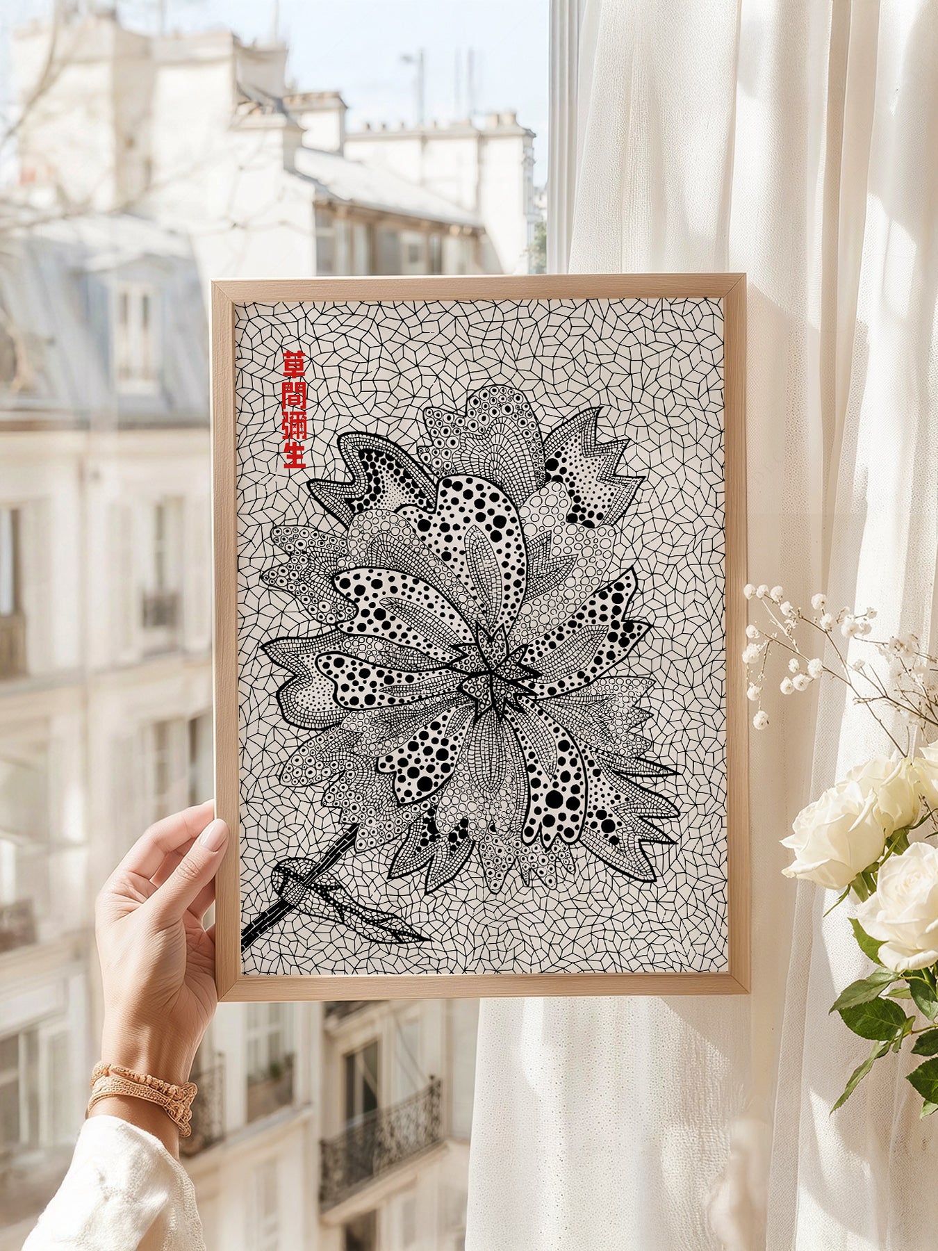 Yayoi Kusama art print as wall decor in a minimalist home office