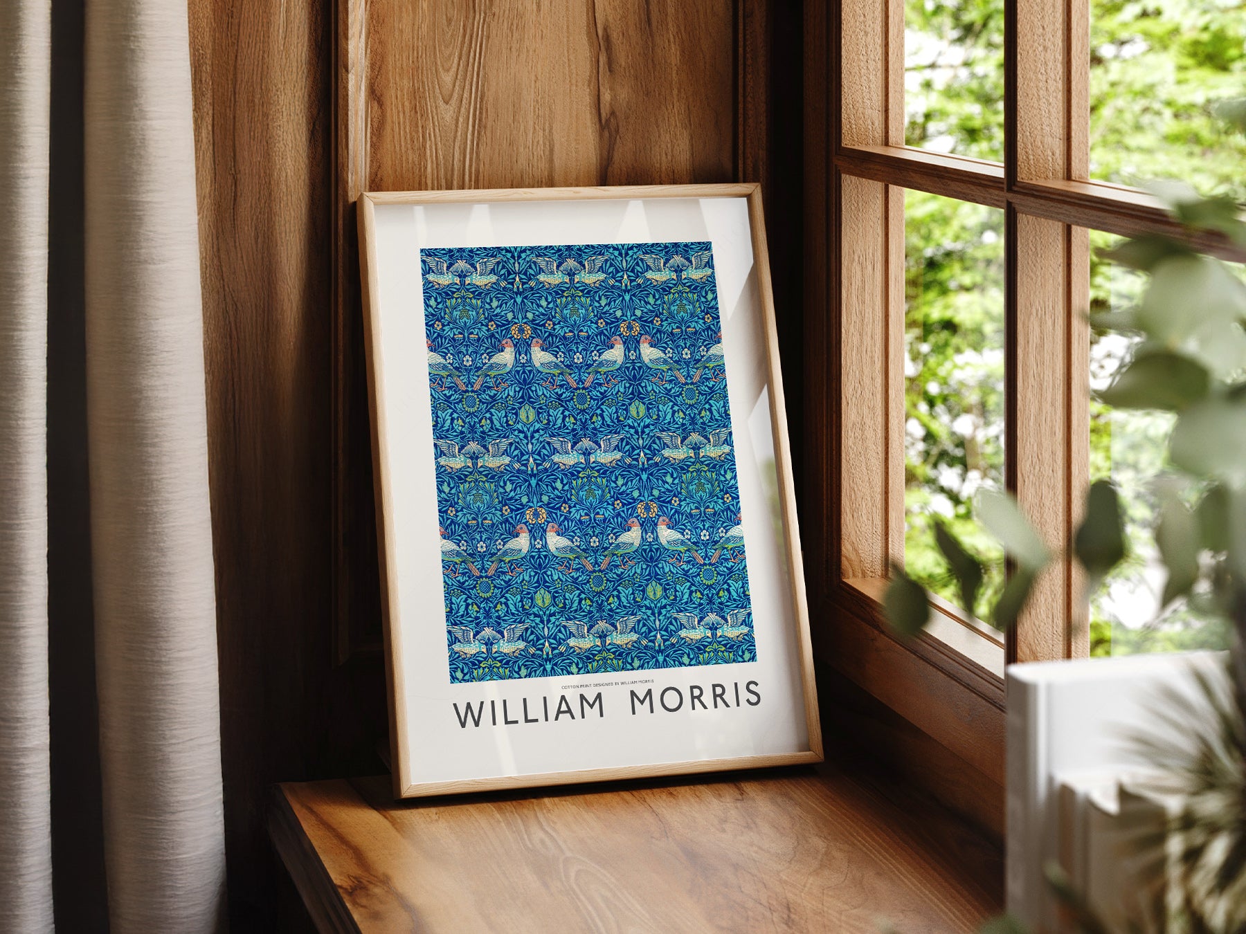 William Morris Bird Pattern print styled in a mid-century modern dining room