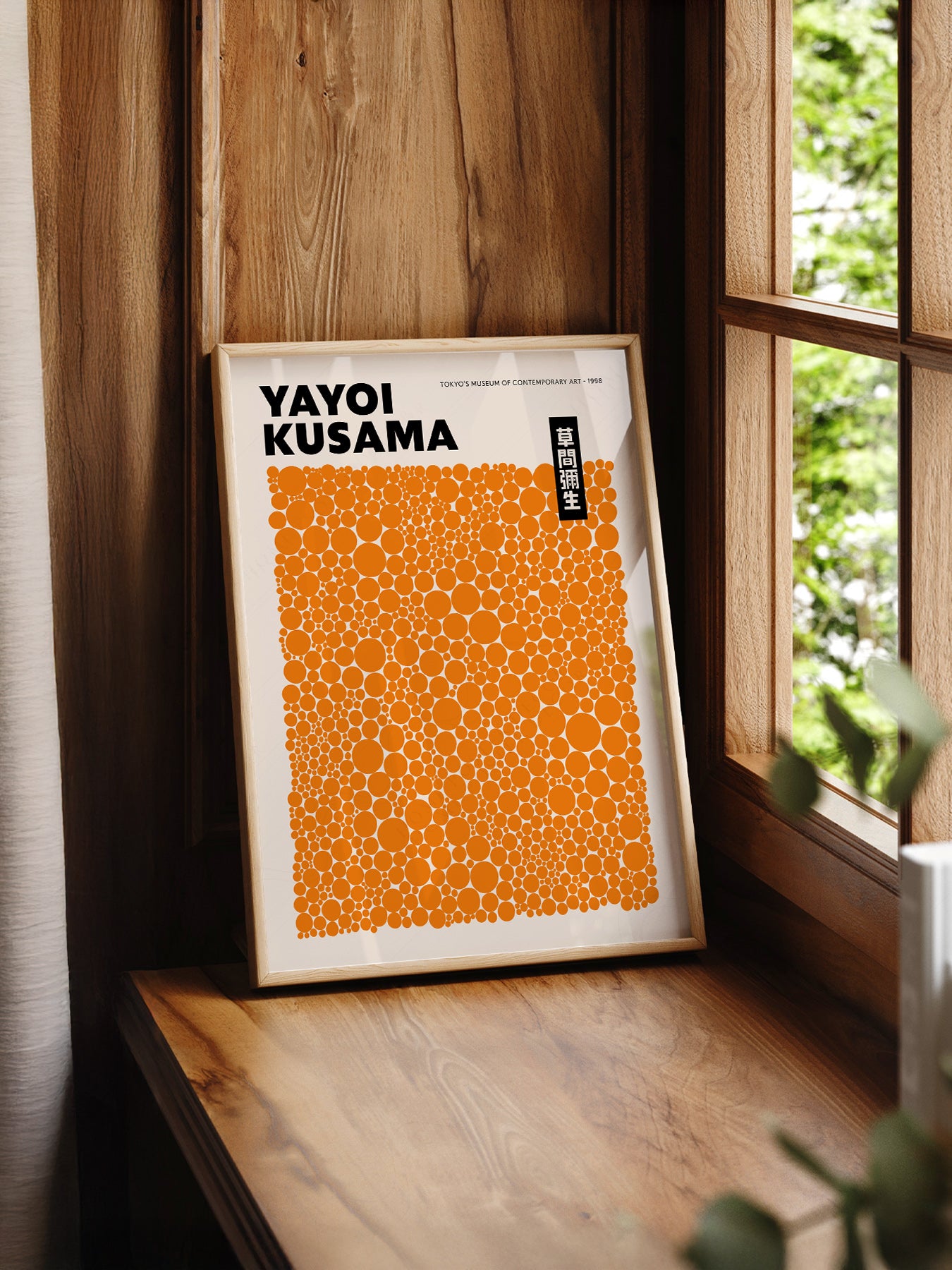 Yayoi Kusama Orange Dots Exhibition print styled in a mid-century modern dining room