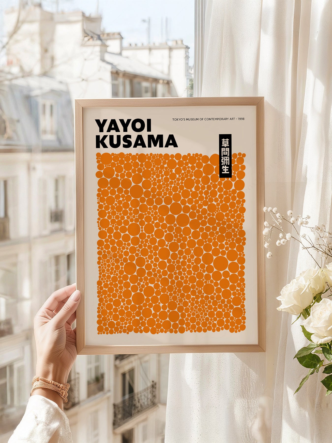 Yayoi Kusama art print as wall decor in a minimalist home office