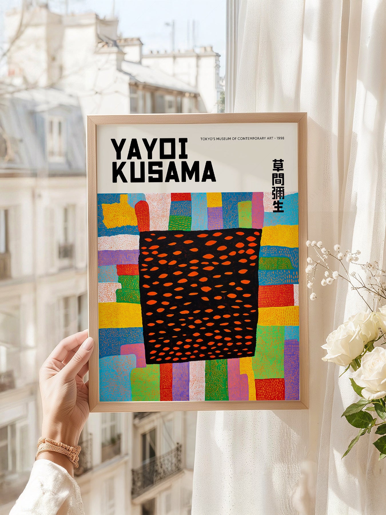 Yayoi Kusama art print as wall decor in a minimalist home office