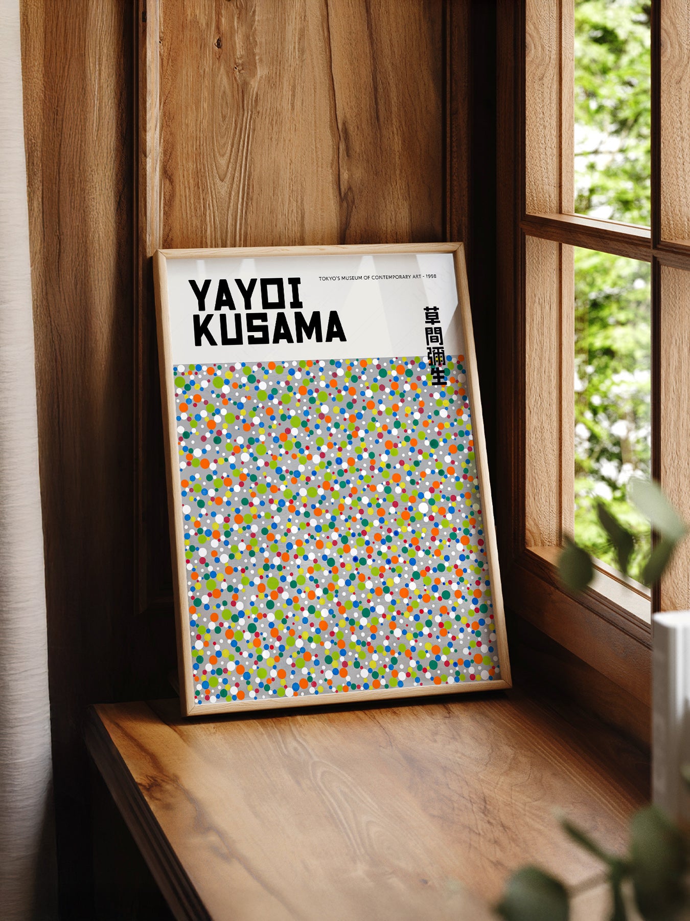 Yayoi Kusama Dots Exhibition print styled in a mid-century modern dining room