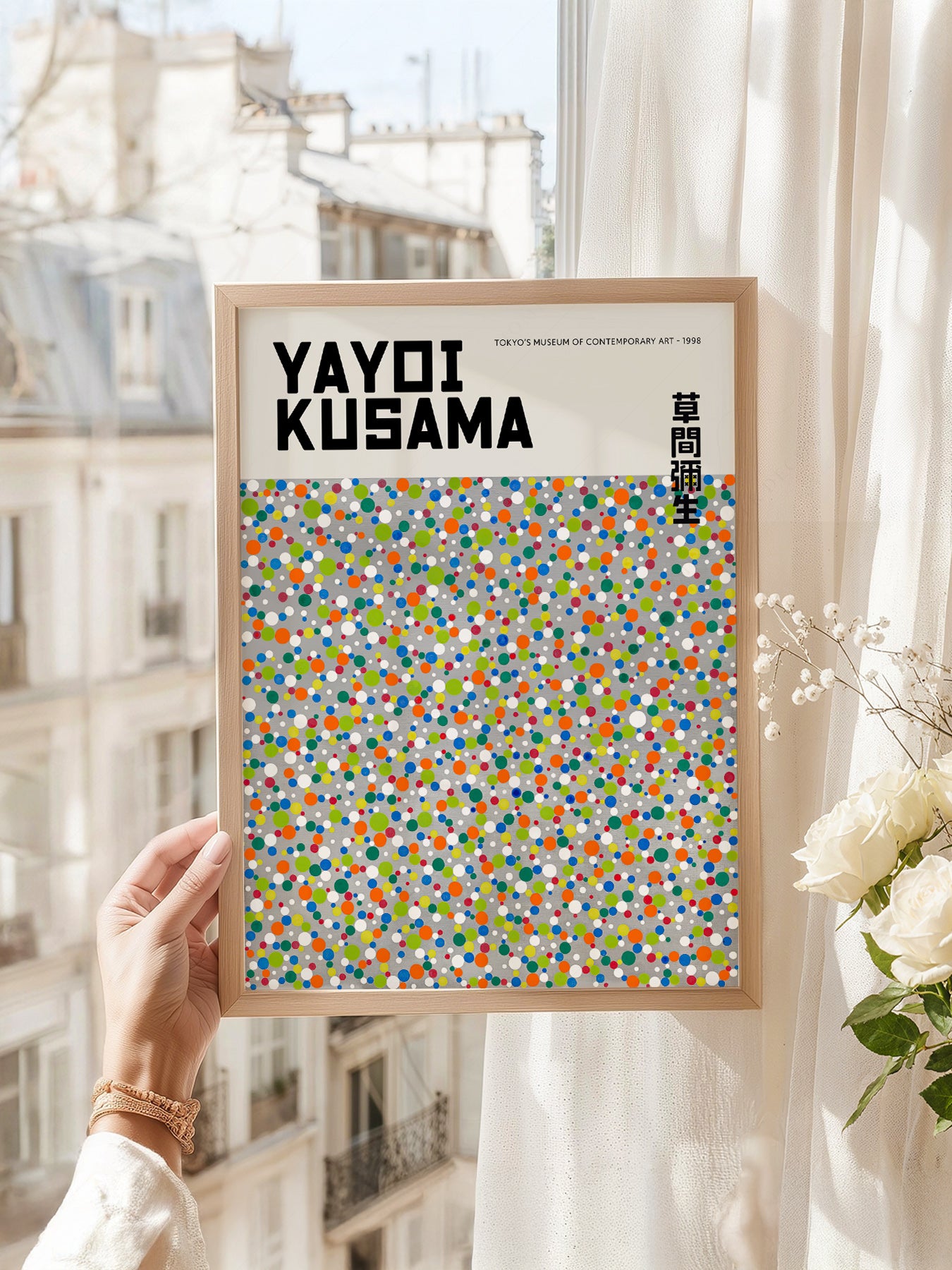 Yayoi Kusama art print as wall decor in a minimalist home office