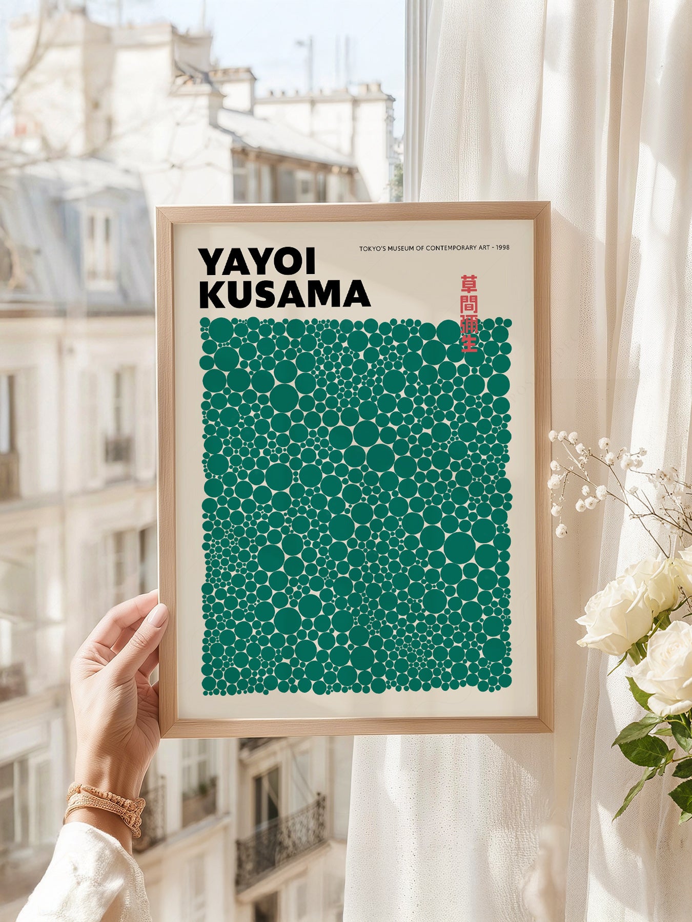 Yayoi Kusama art print as wall decor in a minimalist home office