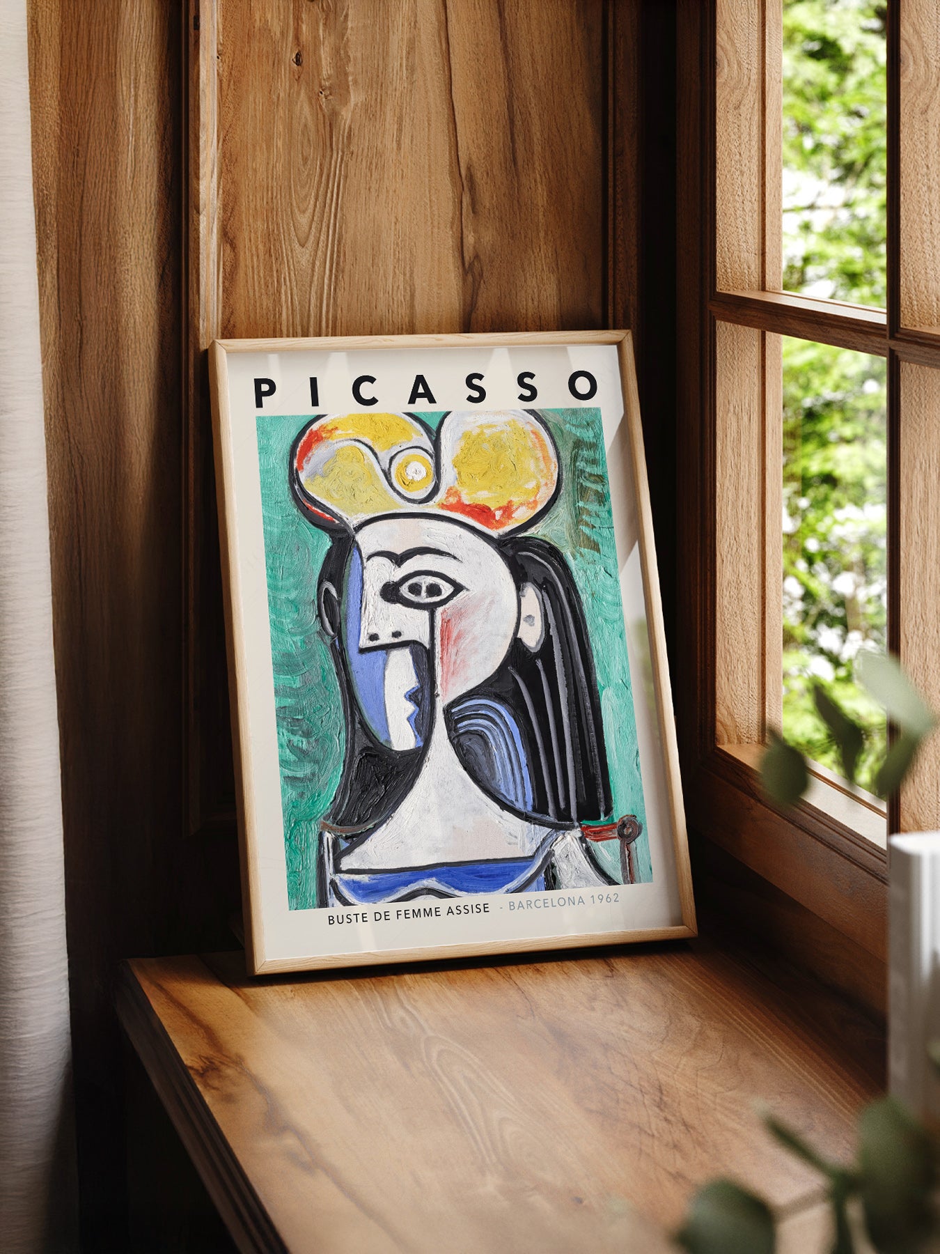 Pablo Picasso Buste de Femme Assise print styled in a mid-century modern dining room