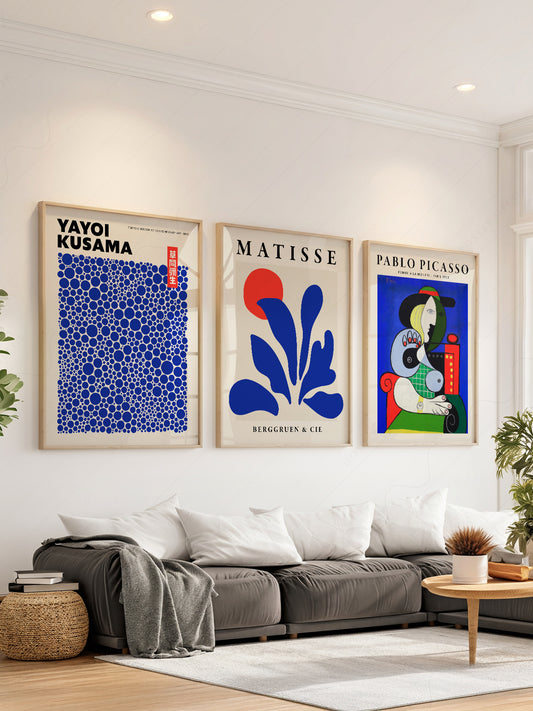 Set of 3 art prints featuring Yayoi Kusama dots, Henri Matisse cut-out, and Pablo Picasso portrait in blue tones.