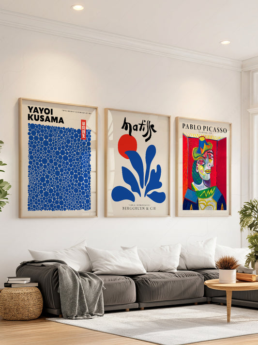 Gallery wall set featuring Yayoi Kusama, Henri Matisse, and Pablo Picasso museum art prints in a modern living room