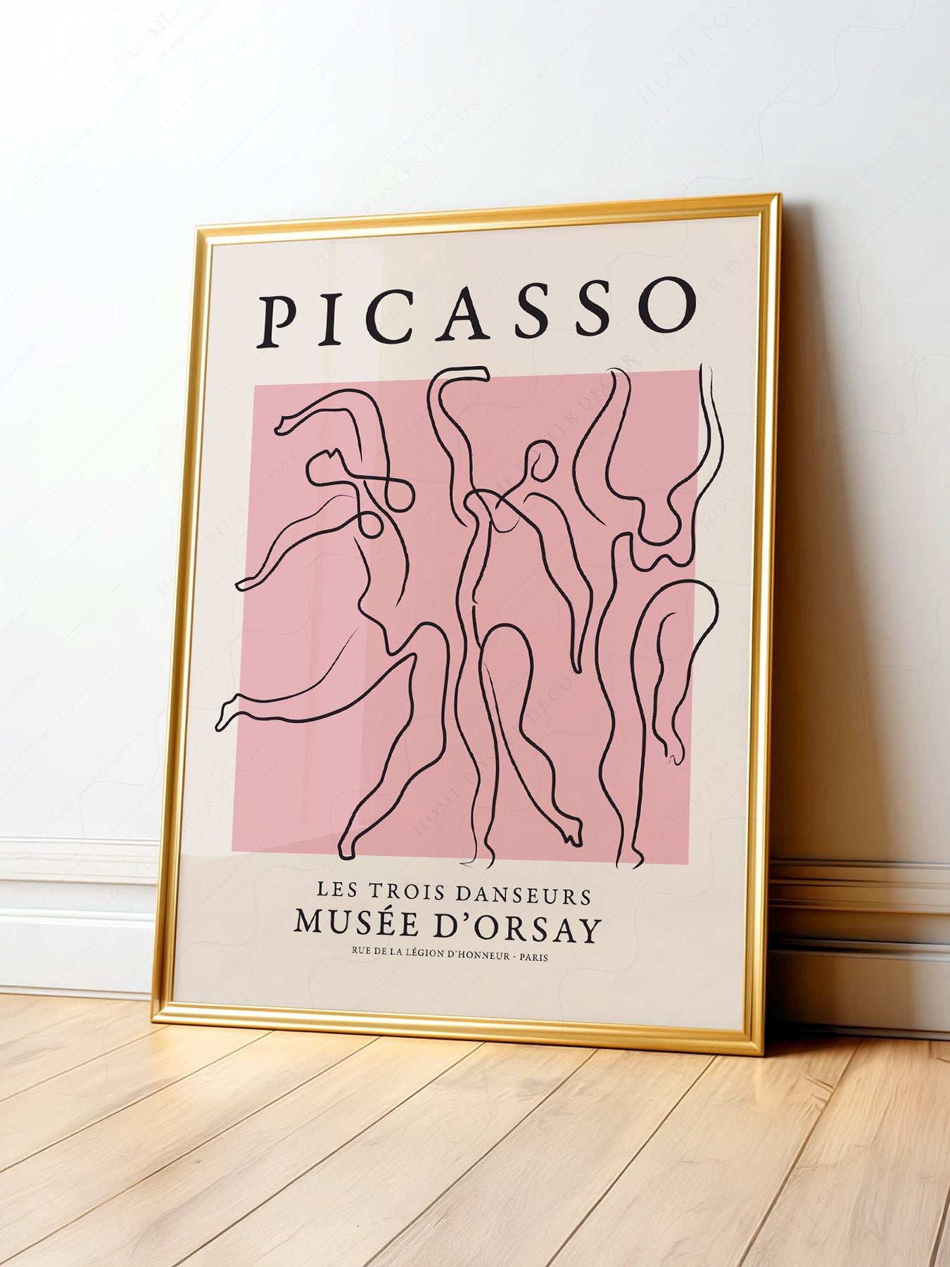 Pablo Picasso Les Trois Danseurs art print featuring three dancing figures in fluid line art on soft pink background.